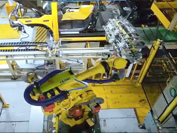 Robotized Rear Seat Loading System (on continuously moving conveyor)